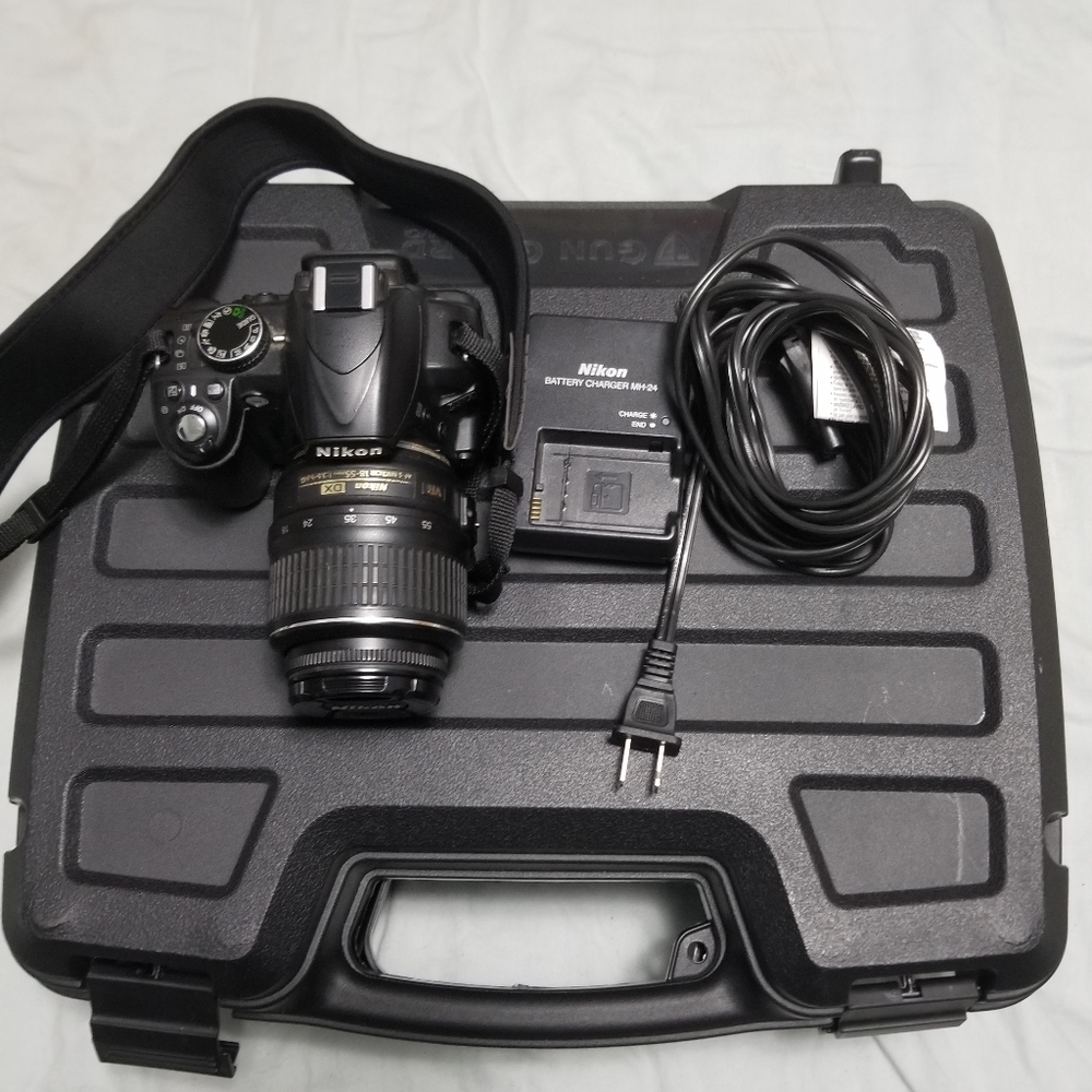 Nikon D3100 DSLR with 18-55mm VR Lens.
